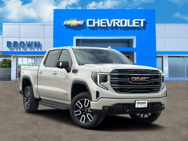 2026 GMC Sierra 1500 AT4 in Coastal Dune — front three-quarter view