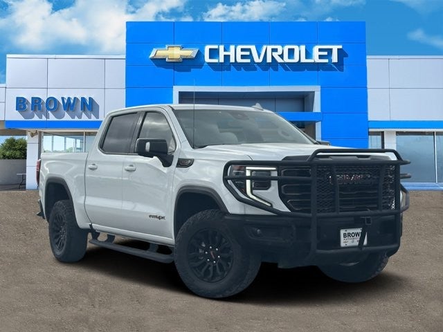 2023 GMC Sierra 1500 AT4X in Summit White — front three-quarter view